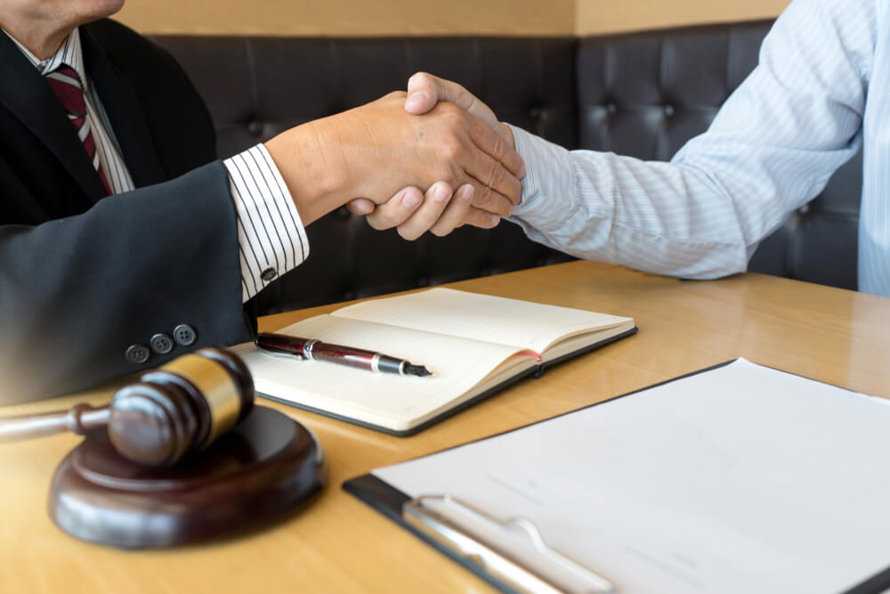 Justice Lawyers Handshake to Businessman or Client for Law Agreement With Judge Gavel